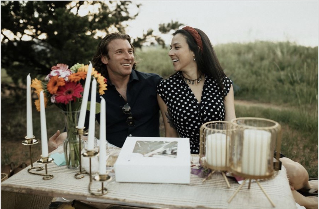 Michael Mattes and Kirstina Garcia smiling together at a table.