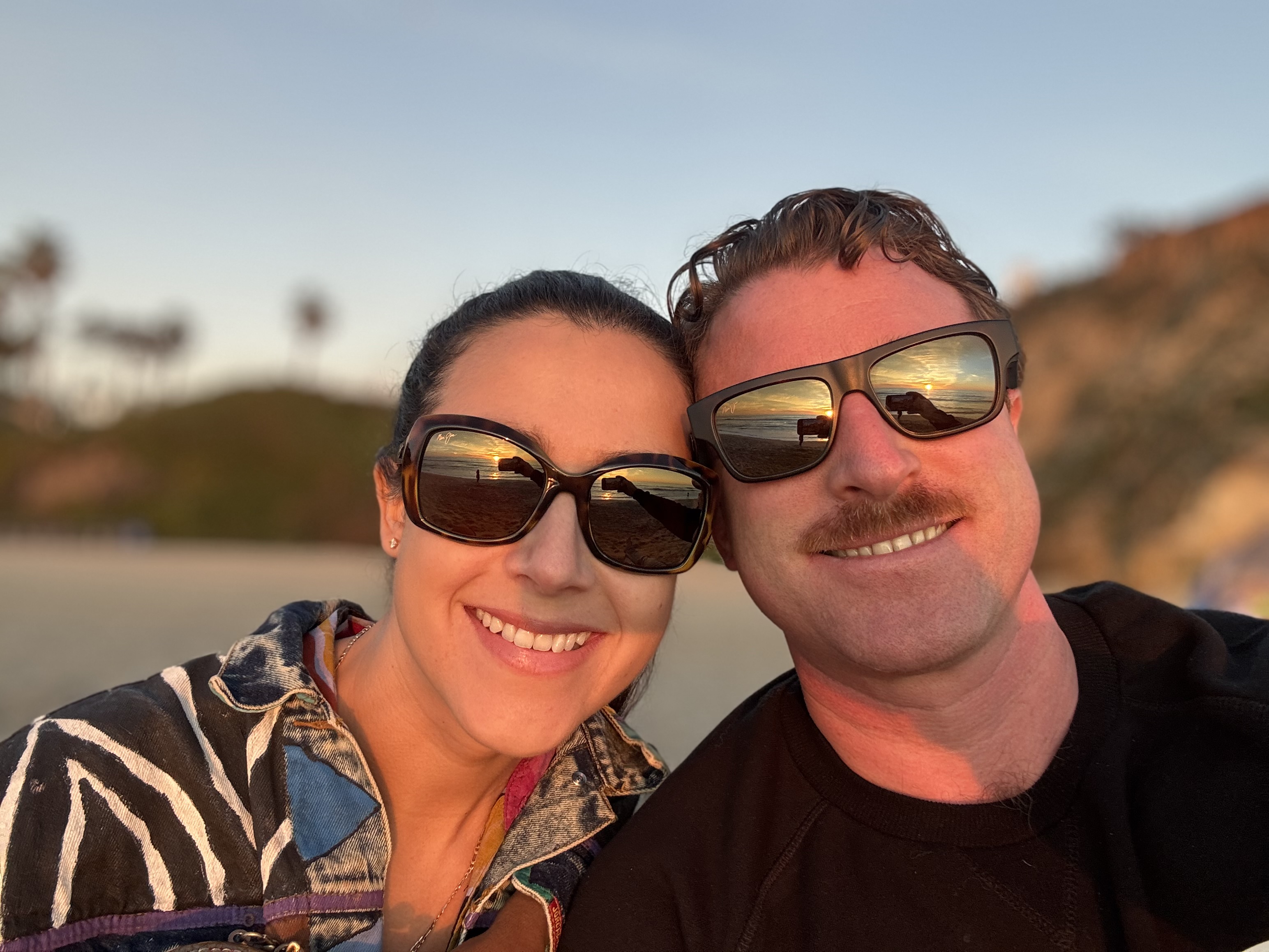 Michael Mattes and Kirstina Garcia taking a beach selfie.